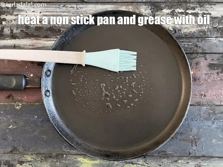Step 18 – Heat a non stick pan and grease with oil.