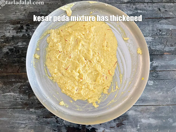 Step 16 – The kesar peda mixture has thickened.