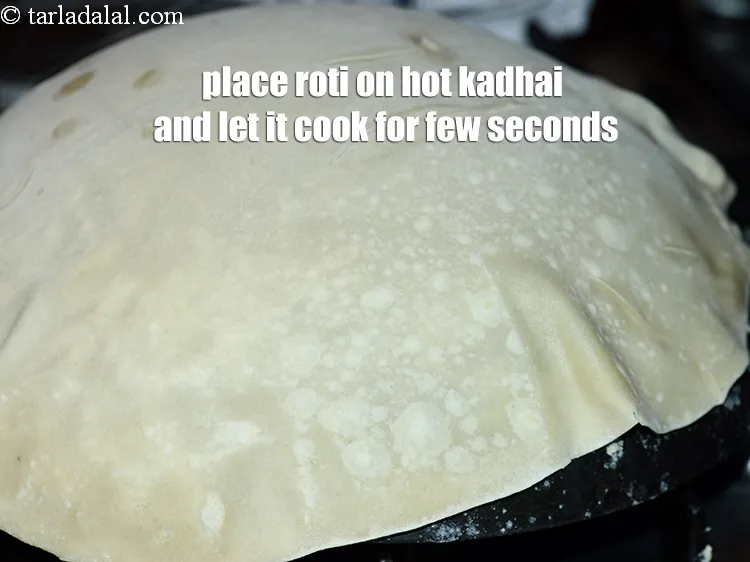 Step 17 – Place the roti on hot kadhai and let it cook on a medium flame for …