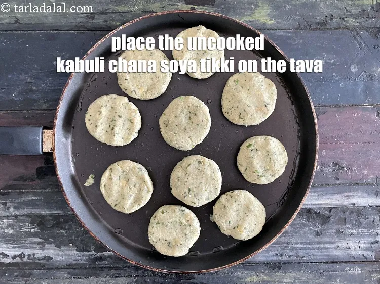 Step 31 – Place the tikkis on the tava.