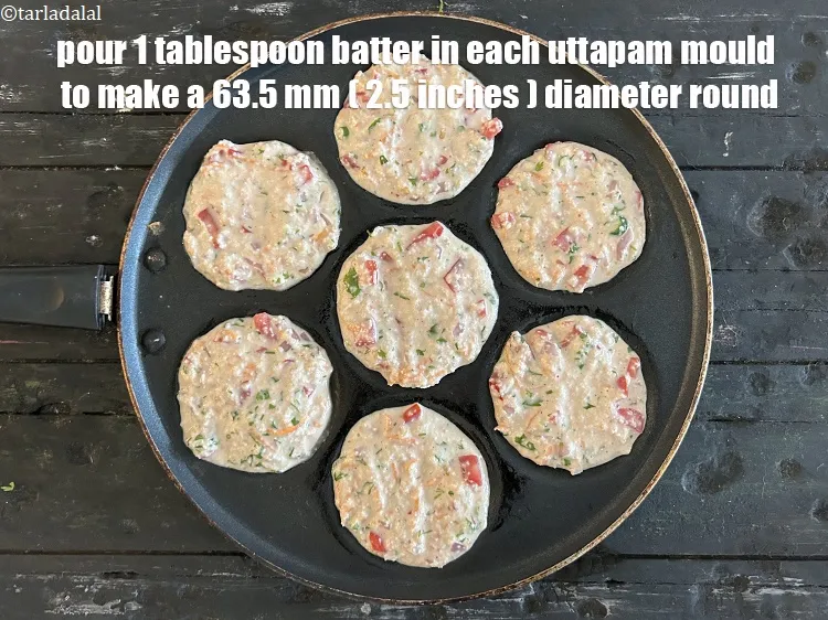 Step 16 – <meta charset="UTF-8" /><meta charset="UTF-8" /> Pour a 1 &nbsp;tablespoon&nbsp;of the batter in each uttapa mould …