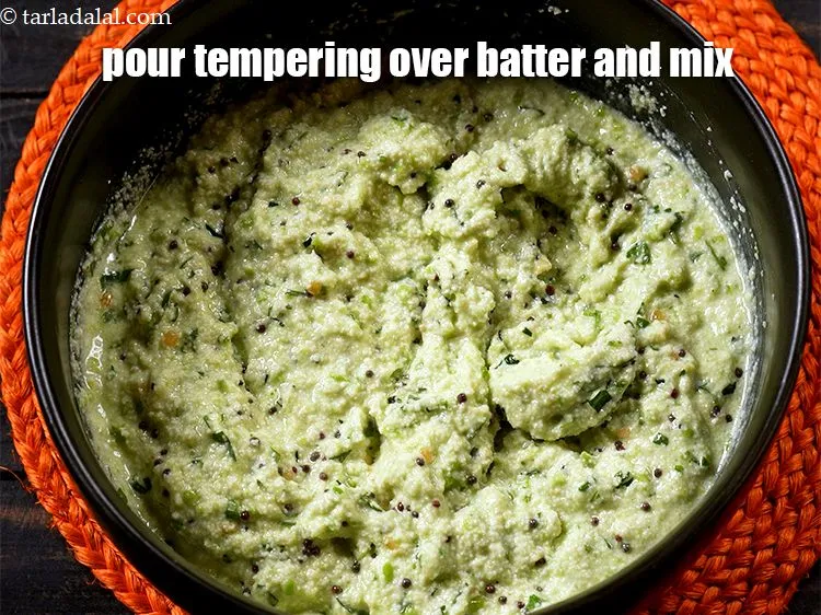 Step 17 – Pour the tempering over the idli batter. Mix well.