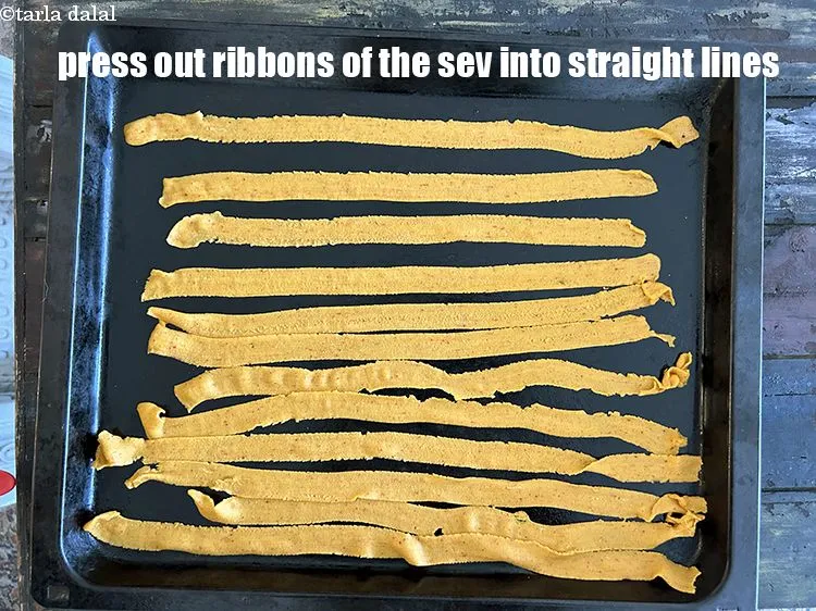 Step 19 – <html><head><meta charset="UTF-8"> </head><body><p>Press out ribbons of the sev arranging them in straight lines.</p></body></html>