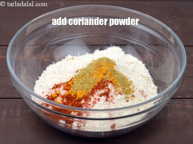 Step 15 – Add 1/2 tsp <a href="https://www.tarladalal.com/glossary-coriander-powder-dhania-powder-370i">coriander (dhania) powder</a>.