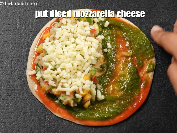 Step 16 – Put 1 tbsp of &lt;a href=&quot;https://www.tarladalal.com/glossary-diced-mozzarella-cheese-2805i&quot;&gt;diced mozzarella cheese&lt;/a&gt;.
