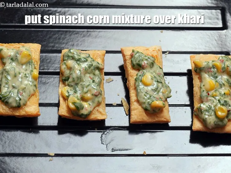 Step 16 – Put a little spinach corn mixture over each khari biscuit.