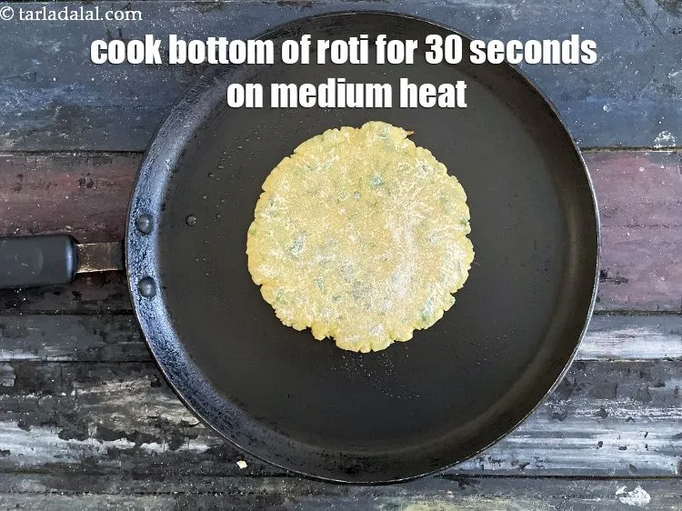Step 18 – Cook the bottom of the roti for 30 seconds on medium heat.&nbsp;