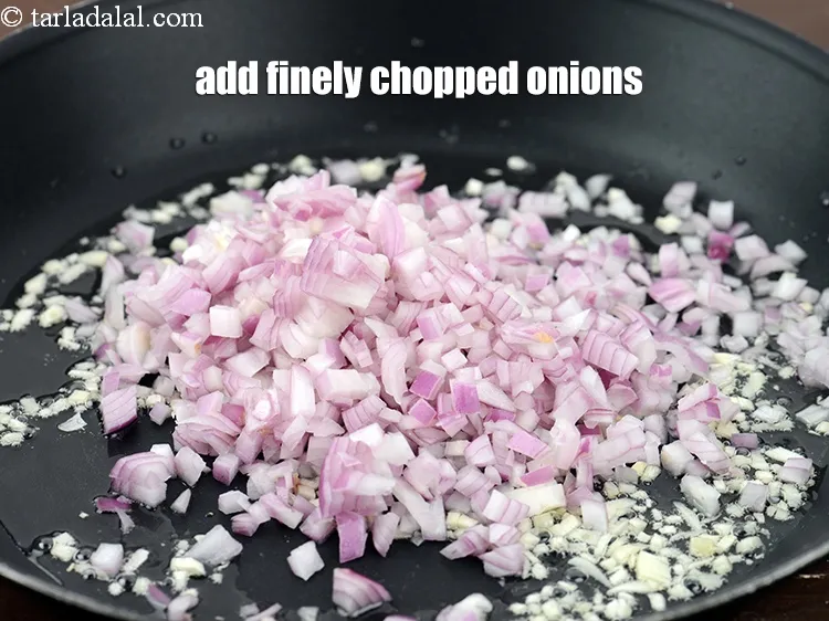 Step 16 – Add 1 cup finely <a href="https://www.tarladalal.com/glossary-chopped-onions-722i">chopped onions</a>.