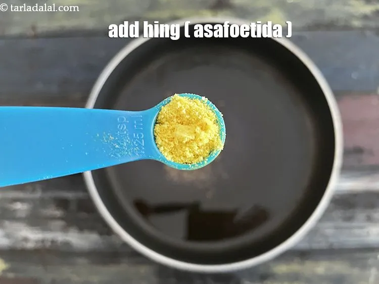 Step 18 – <p>Add&nbsp;1/4 tsp&nbsp;<a href="glossary-asafoetida-hing-113i">asafoetida (hing)</a>.</p>