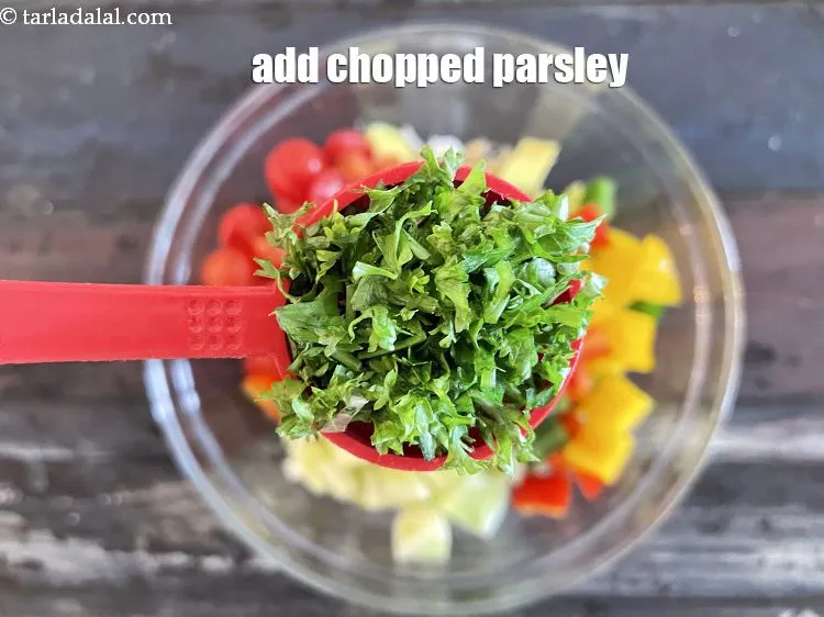 Step 24 – Add&nbsp;2 tbsp&nbsp;<a href="https://tarladalal.com/glossary-chopped-parsley-793i">chopped parsley</a>.