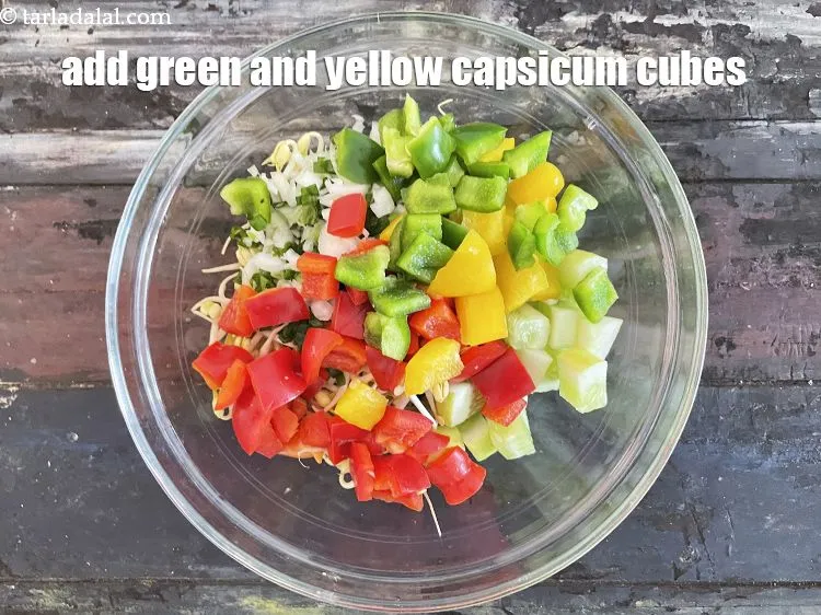 Step 22 – Add&nbsp;1/2 cup green and yellow capsicum cubes.