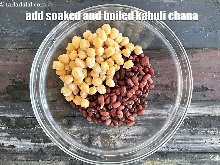 Step 39 – Add&nbsp;<meta charset="UTF-8" />1 cup&nbsp;soaked and&nbsp;<a href="glossary-boiled-kabuli-chana-1354i">boiled kabuli chana (white chick peas)</a>.