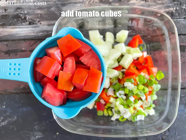Step 22 – Add&nbsp;<meta charset="UTF-8" />1/2 cup&nbsp;deseeded&nbsp;<a href="glossary-tomato-cubes-728i">tomato cubes</a>.