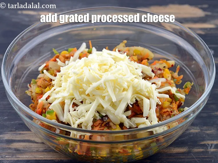Step 15 – Add 1/2 cup&nbsp;<a href="https://www.tarladalal.com/glossary-grated-processed-cheese-868i">grated processed cheese</a>. You can also use mozzarella cheese.