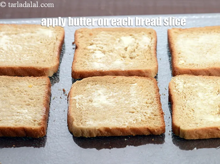 Step 16 – Apply 1 tsp&nbsp;<a href="https://www.tarladalal.com/glossary-soft-butter-naram-makhan-1942i">soft butter</a>&nbsp; on each bread slice and keep aside. Make sure the …