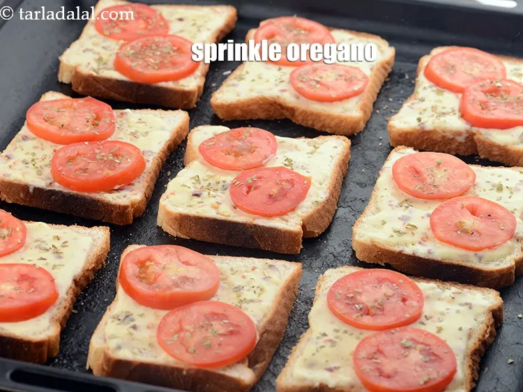 Step 16 – Sprinkle <a href="https://www.tarladalal.com/glossary-dried-oregano-268i">dried oregano</a>&nbsp;evenly over each bread slice.