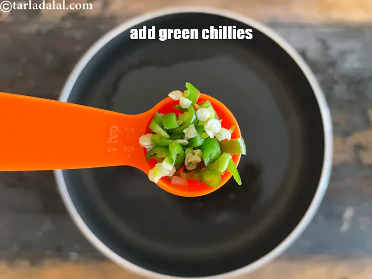 Step 29 – Add&nbsp;<meta charset="UTF-8" />1 tsp&nbsp;finely&nbsp;<a href="glossary-chopped-green-chilli-820i">chopped green chillies</a>.