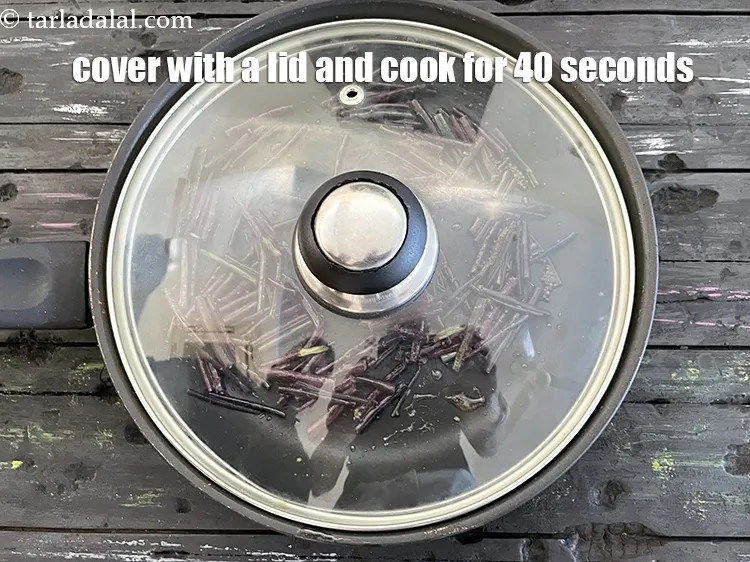 Step 16 – Cover with a lid and cook on a high flame for 40 seconds.