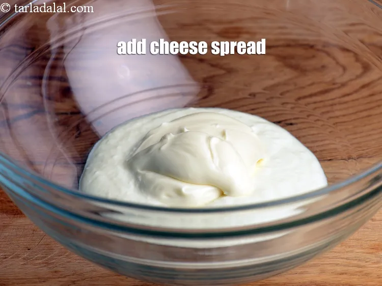 Step 19 – Add 2 tbsp <a href="https://www.tarladalal.com/glossary-cheese-spread-309i">cheese spread</a>.