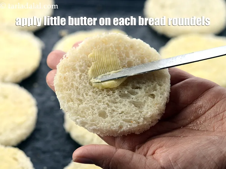 Step 16 – Apply a little butter on each bread roundels using butter knife.