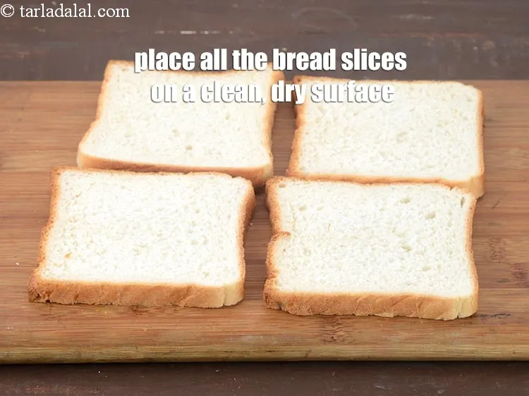 Step 16 – Place all the <a href="https://www.tarladalal.com/glossary-bread-219i">bread</a>&nbsp;slices on a clean, dry surface.