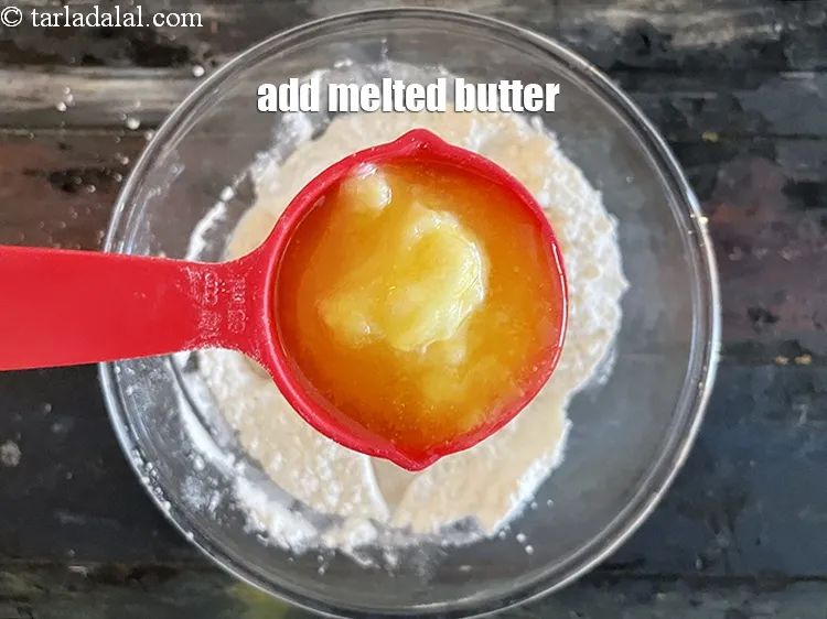 Step 20 – Add&nbsp;<meta charset="UTF-8" />1/3 rd&nbsp;cup&nbsp;<a href="glossary-melted-butter-1941i">melted butter</a>.