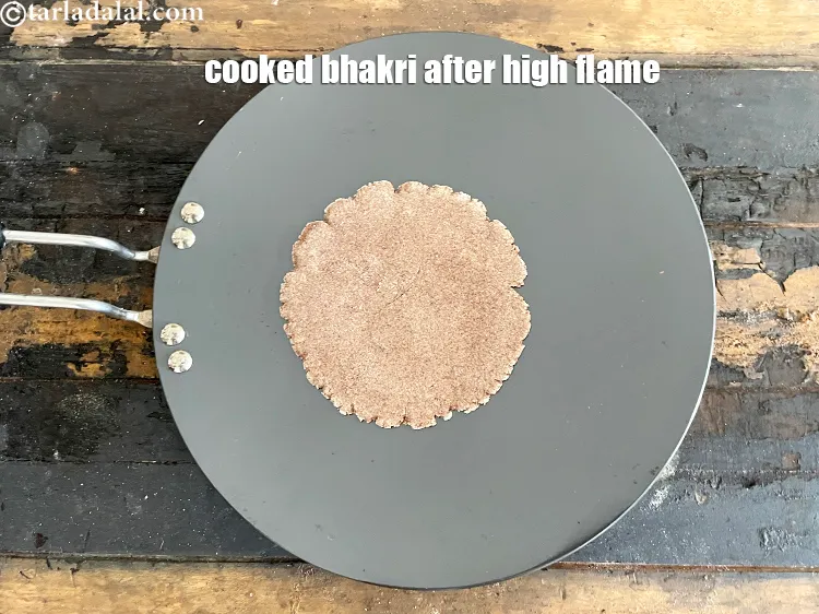 Step 27 – This is what the roti looks like. Flip over and cook the other side for …