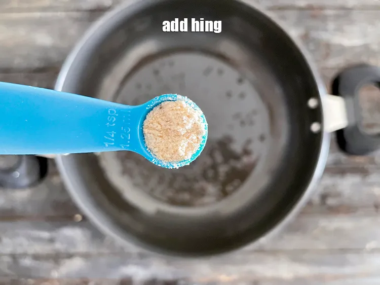 Step 26 – Add &nbsp;<meta charset="UTF-8" />a pinch of&nbsp;<a href="glossary-asafoetida-hing-113i">asafoetida (hing)</a>.