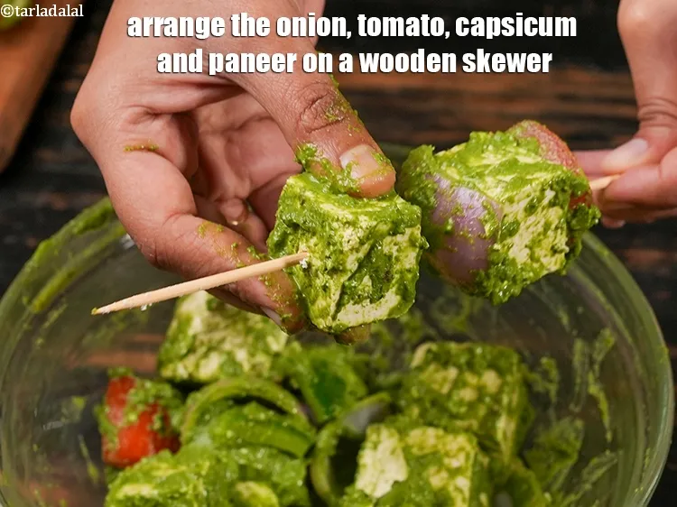 Step 18 – Arrange the onion, tomato, capsicum and paneer on a wooden skewer.