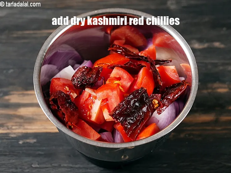 Step 17 – Add 2&nbsp;<a href="https://www.tarladalal.com/glossary-soaked-dry-kashmiri-red-chillies-2304i">soaked dry kashmiri red chillies</a>.