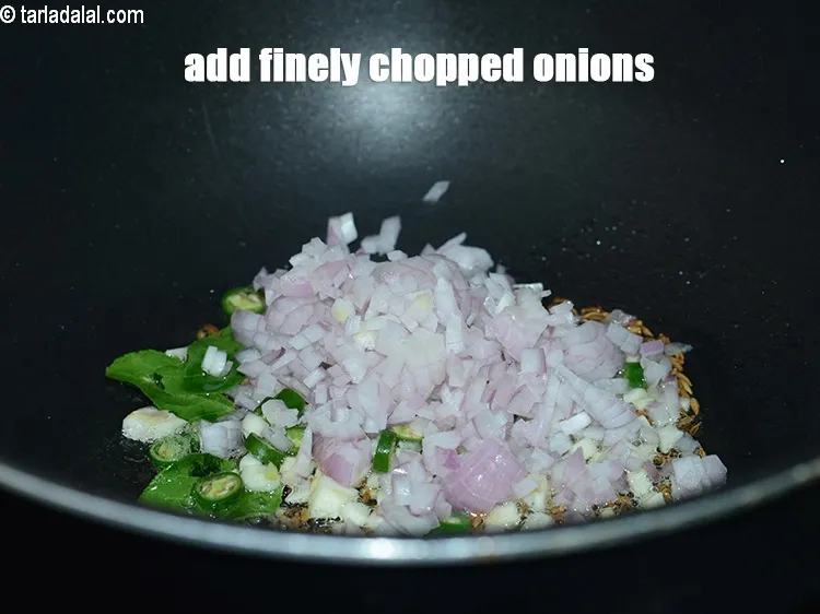 Step 17 – Add &frac14; cup finely <a href="https://www.tarladalal.com/glossary-chopped-onions-722i">chopped onions</a>.