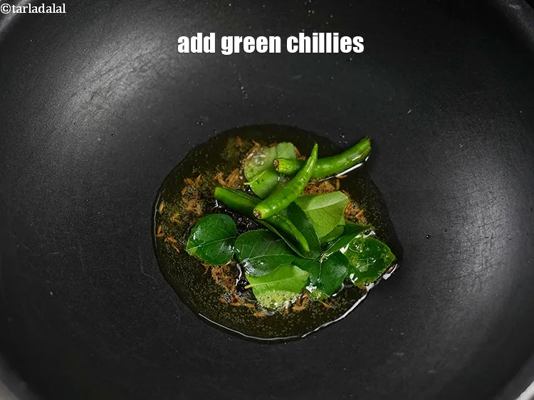 Step 17 – Add 2 slit green chillies.&nbsp;