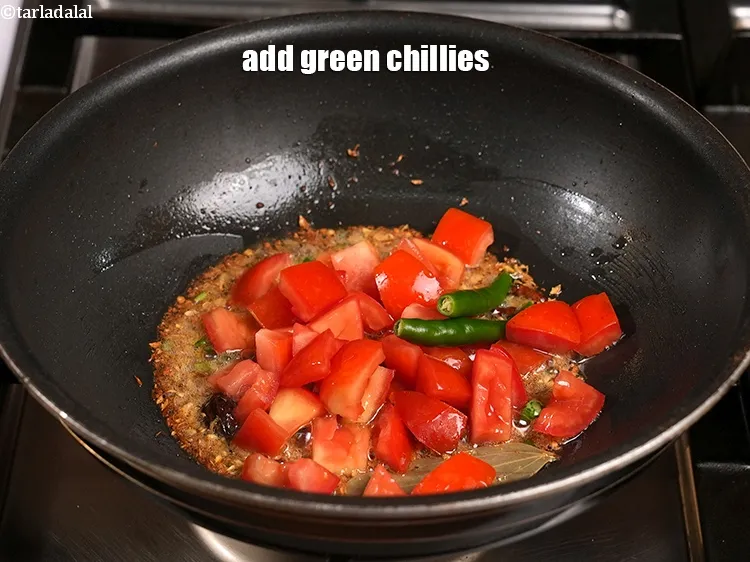 Step 17 – Add 2 <a href="https://www.tarladalal.com/glossary-green-chillies-hari-mirch-331i">green chillies</a>.