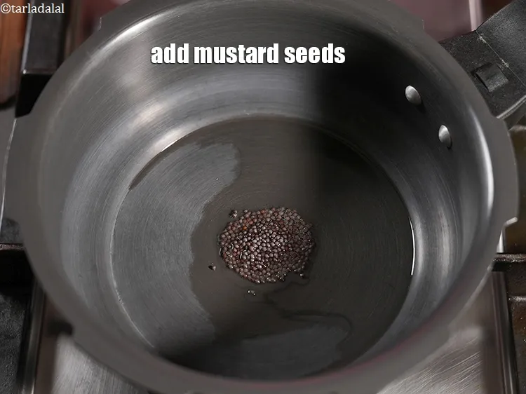 Step 17 – Add &frac12; tsp <a href="https://www.tarladalal.com/glossary-mustard-seeds-sarson-rai-sarson-ke-beej-525i">mustard seeds ( rai / sarson)</a>.