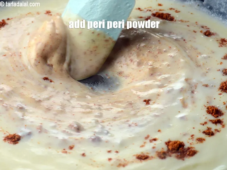 Step 18 – Add 2 tbsp&nbsp;<a href="https://www.tarladalal.com/peri-peri-masala-40207r">peri peri masala</a>.