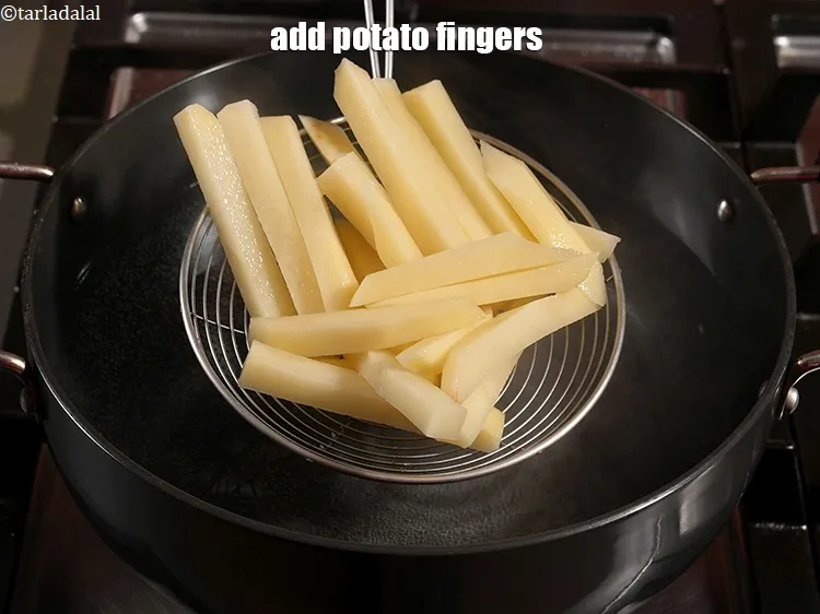 Step 17 – Add 3 cups <a href="https://www.tarladalal.com/glossary-potato-fingers-1065i">potato fingers</a>.