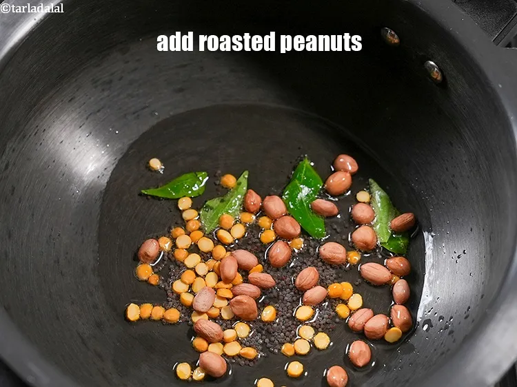 Step 17 – Add 2 tbsp&nbsp;<a href="https://www.tarladalal.com/glossary-roasted-peanuts-871i">roasted peanuts</a>.