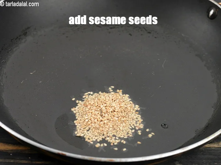 Step 17 – Add 1 tsp&nbsp;<a href="https://www.tarladalal.com/glossary-sesame-seeds-til-gingelly-seeds-612i">sesame seeds (til)</a>.