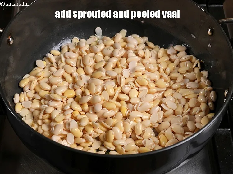 स्टेप 33 – २ कप&nbsp;<a href=""https://www.tarladalal.com/glossary-sprouted-vaal-field-beans-butter-beans-hindi-200i"">अंकुरित और छिले हुए वाल</a>&nbsp;डालें&nbsp;&nbsp;।