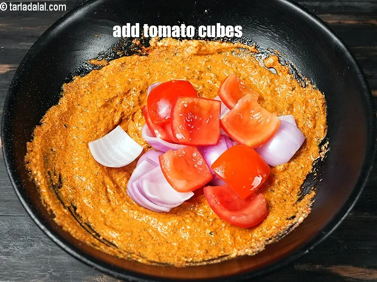 Step 18 – Add &frac12; cup <a href="https://www.tarladalal.com/glossary-tomato-cubes-728i">tomato cubes</a>.