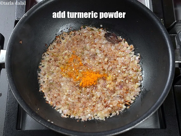 Step 21 – Add &frac14; tsp <a href="https://www.tarladalal.com/glossary-turmeric-powder-haldi-645i">turmeric powder (haldi)</a>.