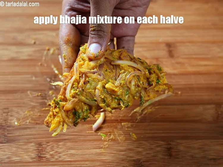 Step 18 – Apply the bhajia mixture on each halve of the bread.