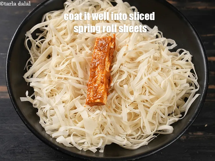 Step 17 – Then coat it well into thinly sliced spring roll sheets.