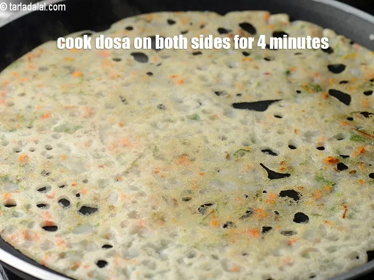 Step 19 – Cook the dosa on both the sides on medium flame for 4 minutes until it …