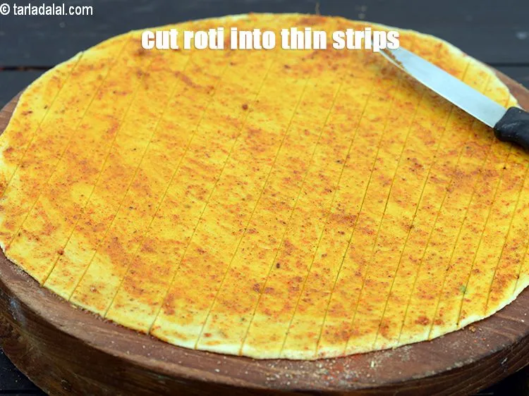 Step 17 – Cut the roti vertically into thin strips.