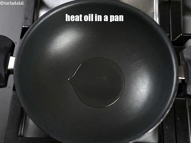 Step 16 – Heat 3 tbsp oil in a deep pan.