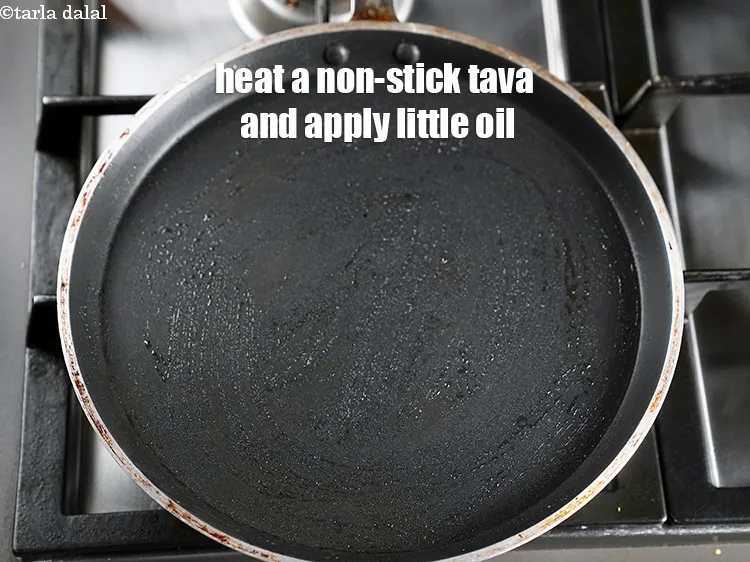 Step 17 – Heat a non-stick tava (griddle), apply little oil.