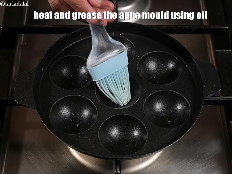 Step 17 – Heat and grease the appe mould using &frac12; tsp oil.