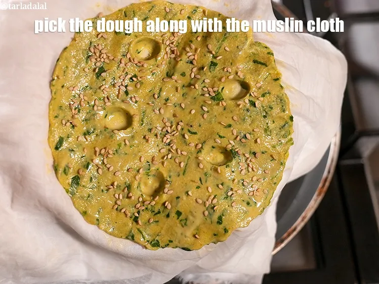 Step 19 – Pick the dough along with the muslin cloth.