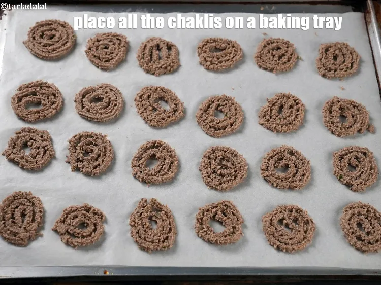Step 17 – Place all the chaklis on a baking tray.
